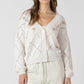 THE DELANE EMBROIDERED POINTELLE CARDI